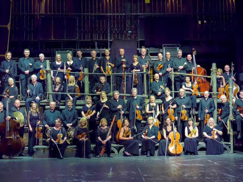 The ENO Orchestra group photo on stage