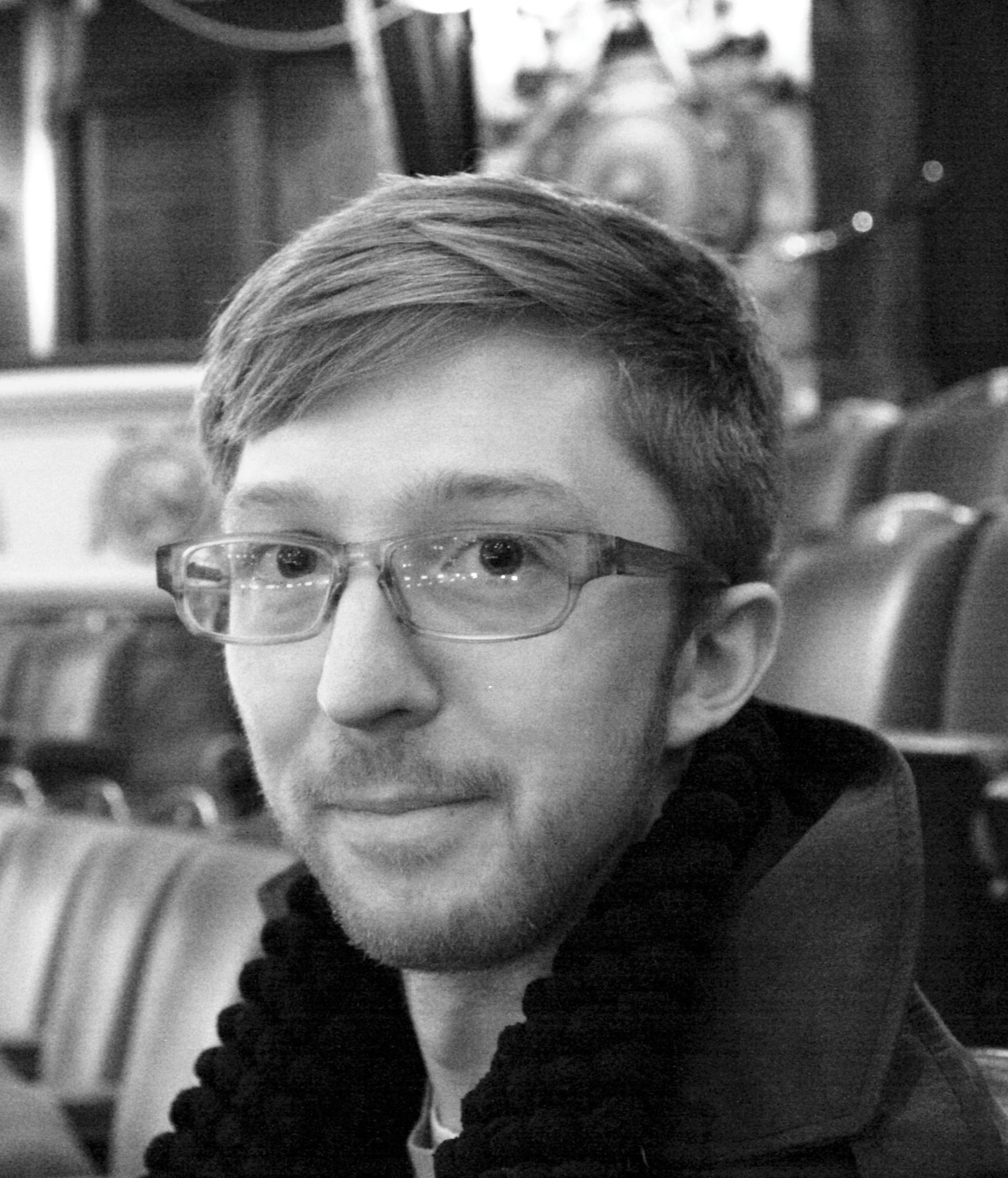 Black ad white headshot of Finn Ross