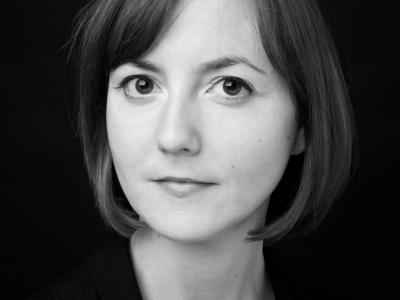 Black and white headshot of Josie Daxter facing camera