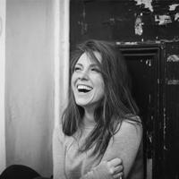 black and white photo of mary bevan laughing