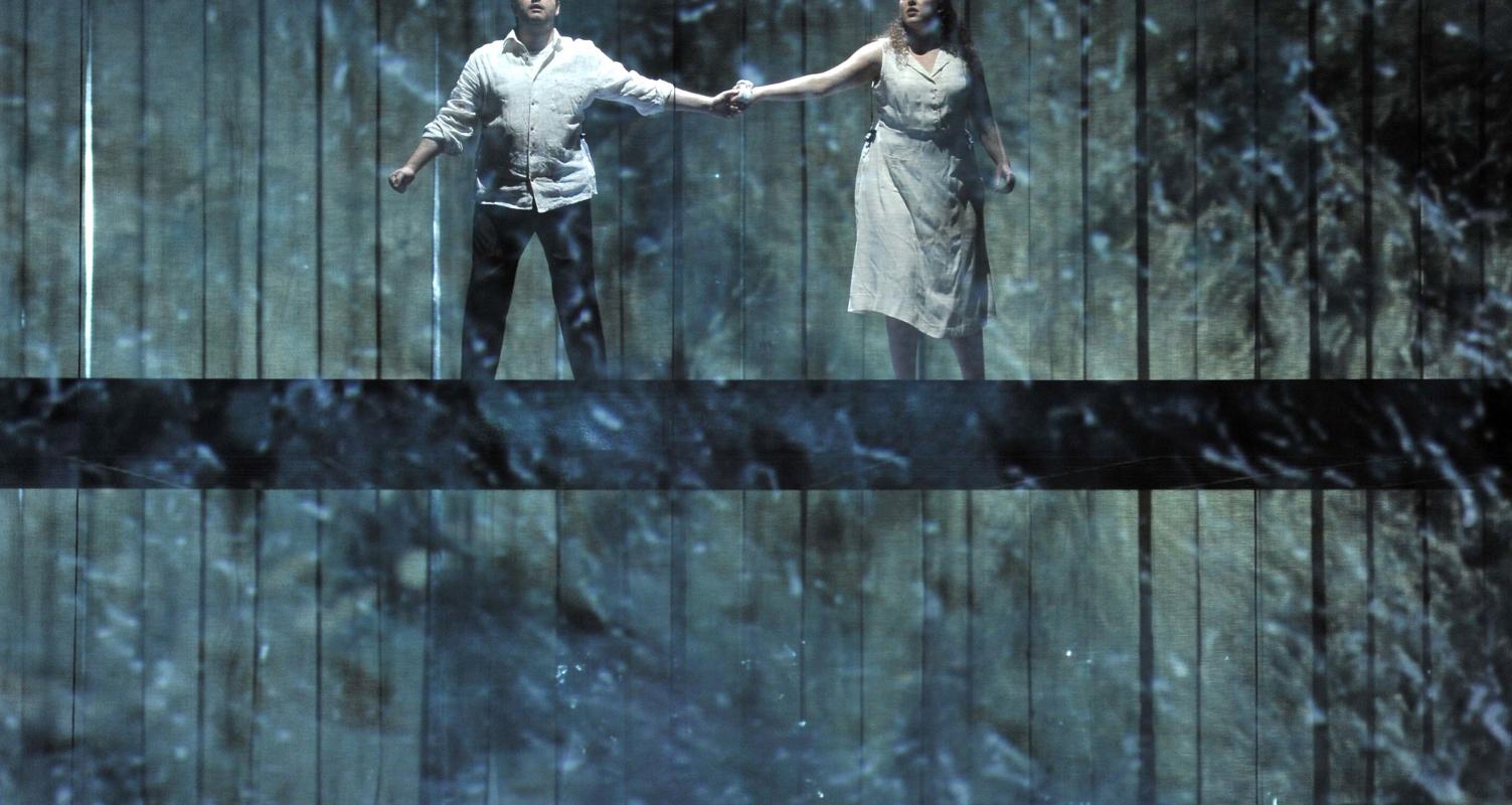 Two people holding hands in ENO's The Magic Flute