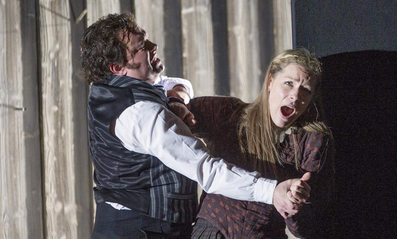 Man attacking woman on stage in ENO's Norma