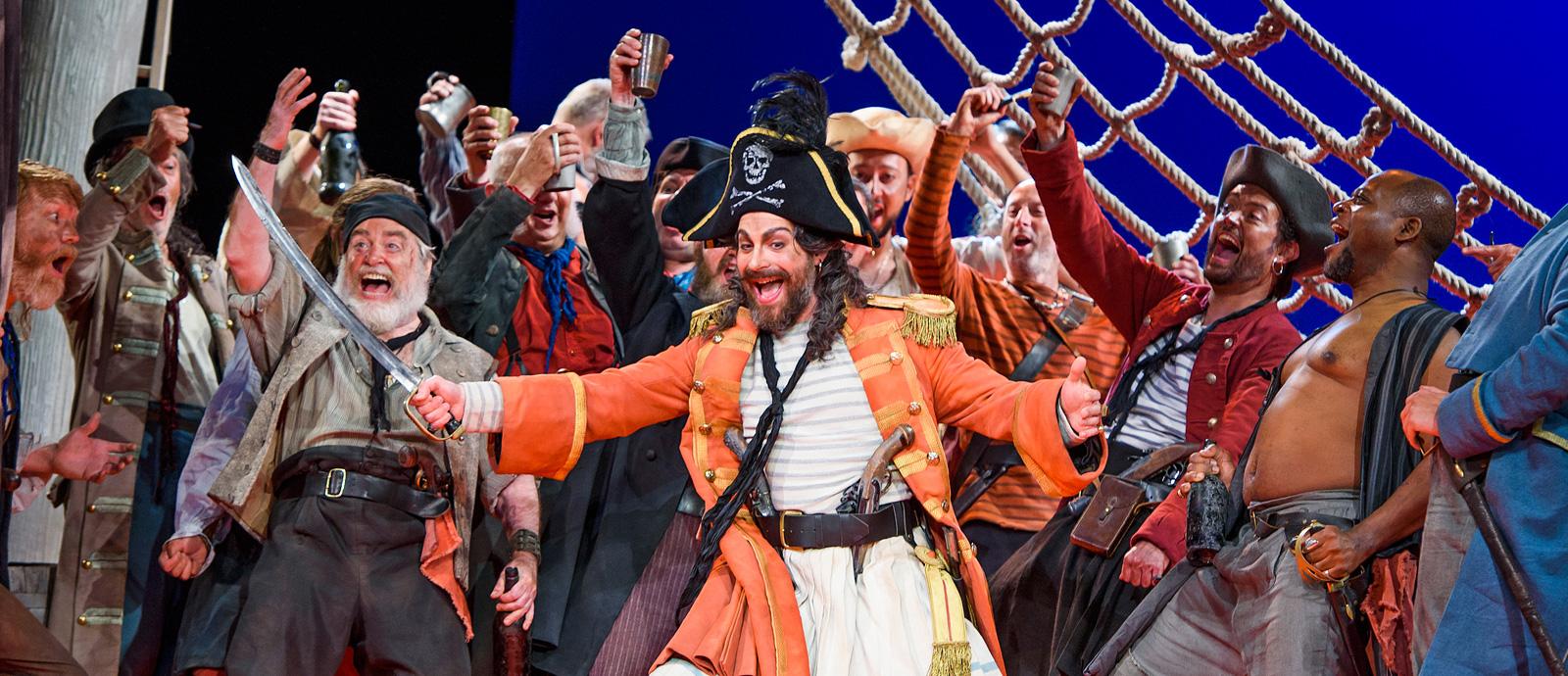ENO's The Pirates of Penzance - Joshua Bloom as the Pirate King and Company. Photo by Tristram Kenton
