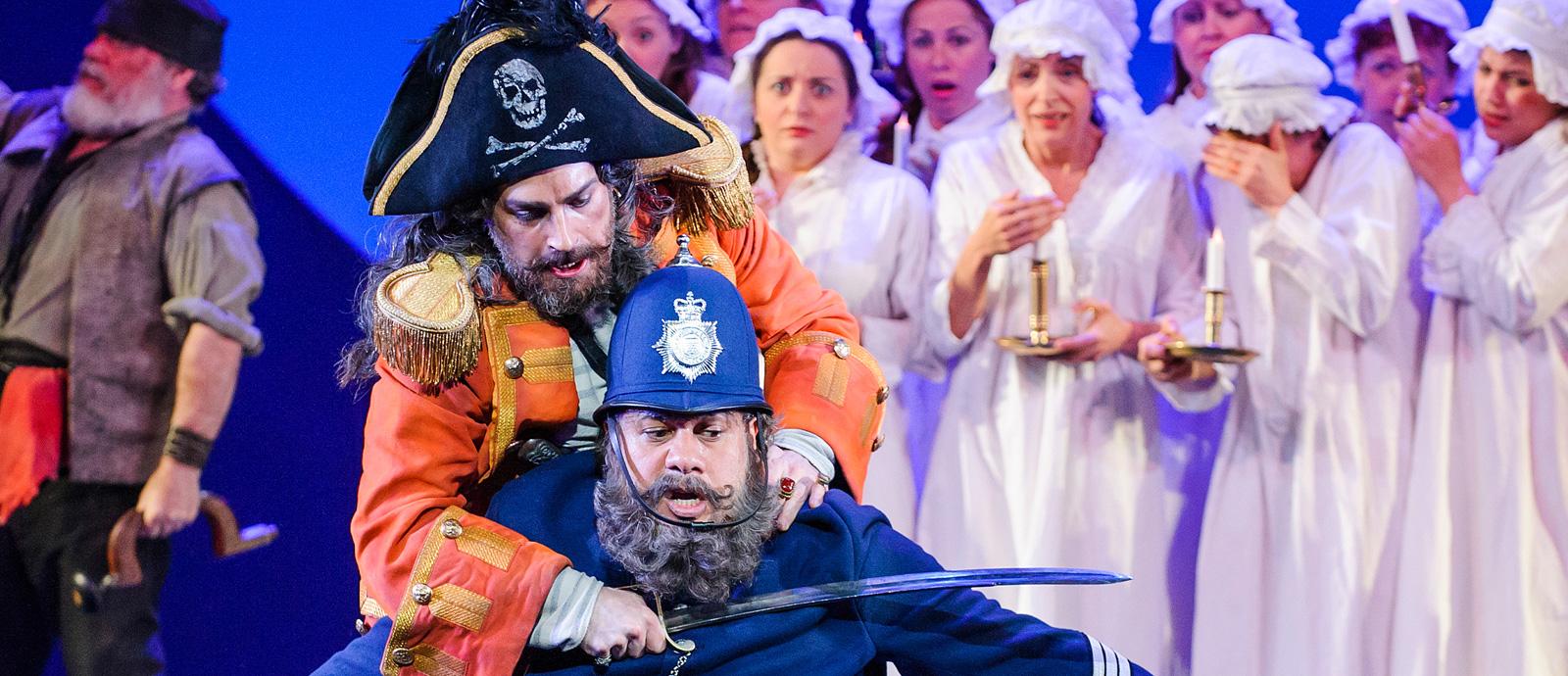 ENO's The Pirates of Penzance - Joshua Bloom as the Pirate King and Jonathan Lemalu as Sergeant of Police. Photo by Tristram Kenton