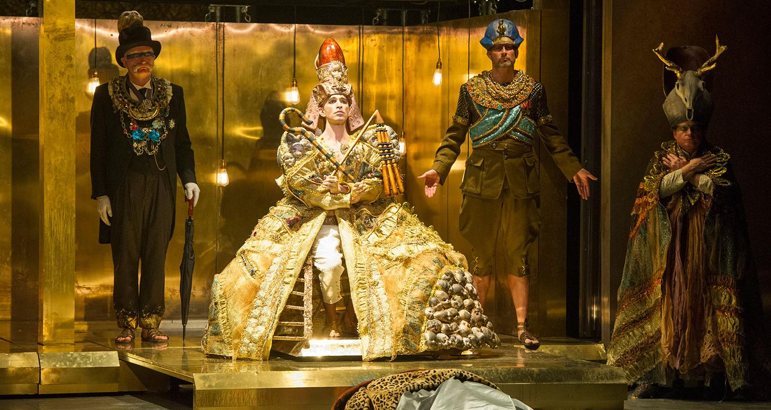 Akhnaten in his robes and headress, all in gold