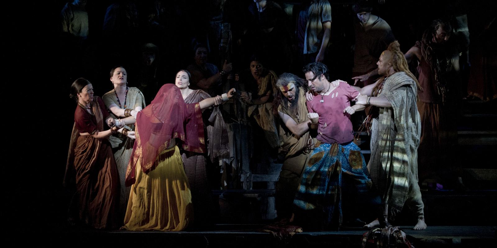 Man and woman being pulled apart in ENO's The Pearl Fishers