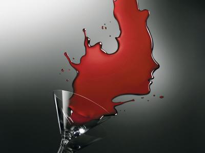 red wine coming out of a wine glass