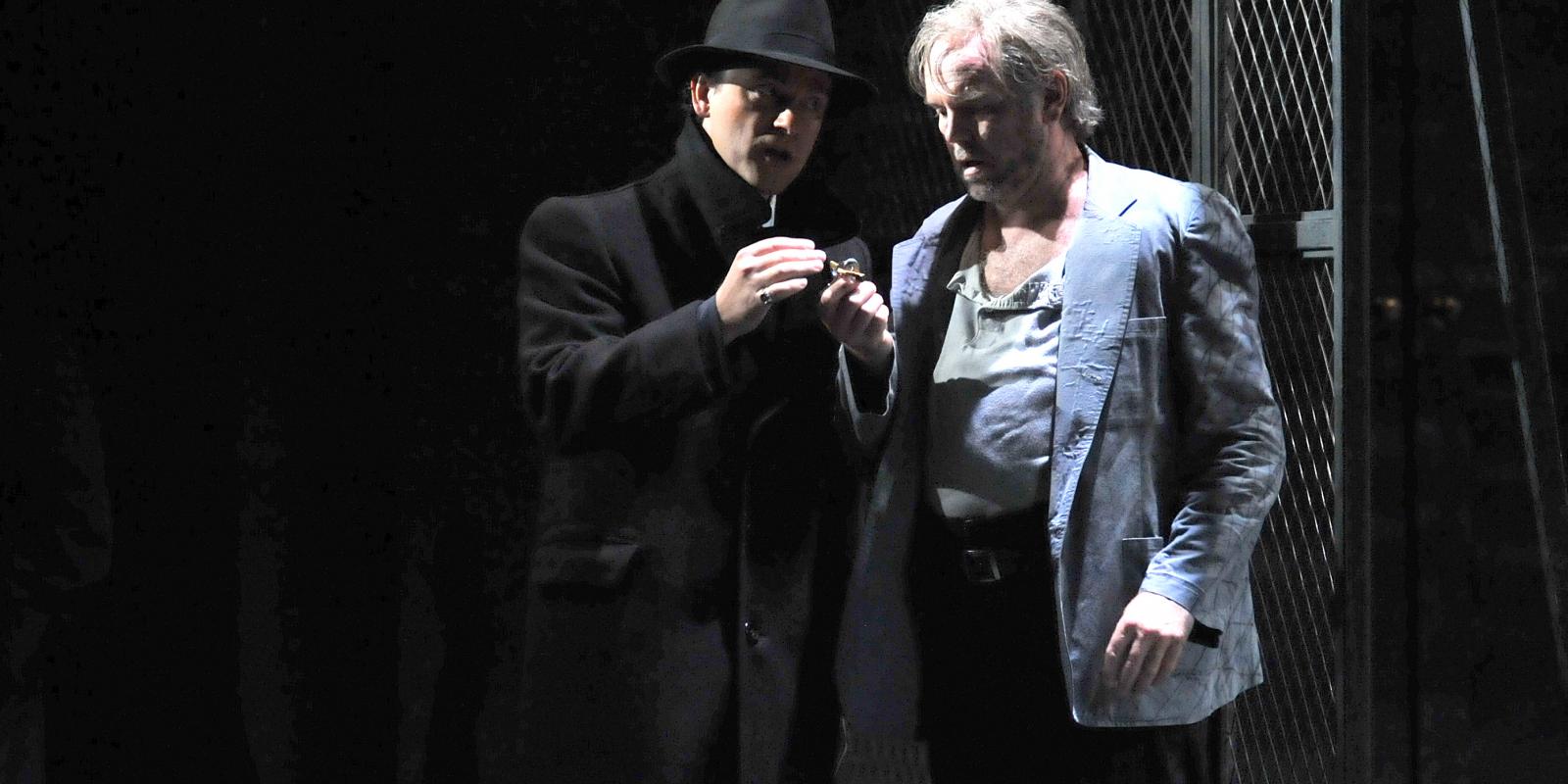 two man smoking at night time as part of ENO's Rigoletto