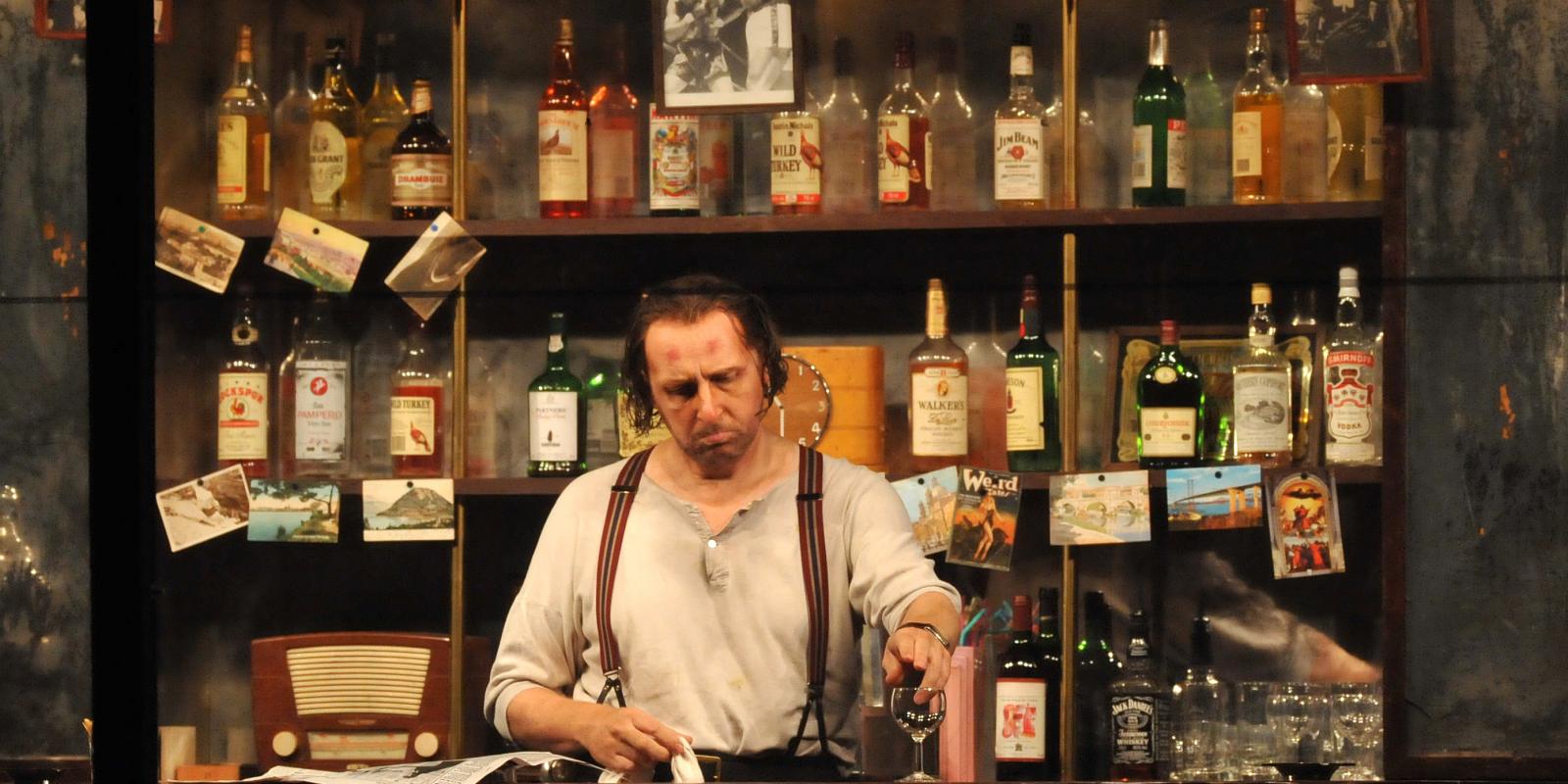 Rigoletto's Iain Paterson during a bar scene