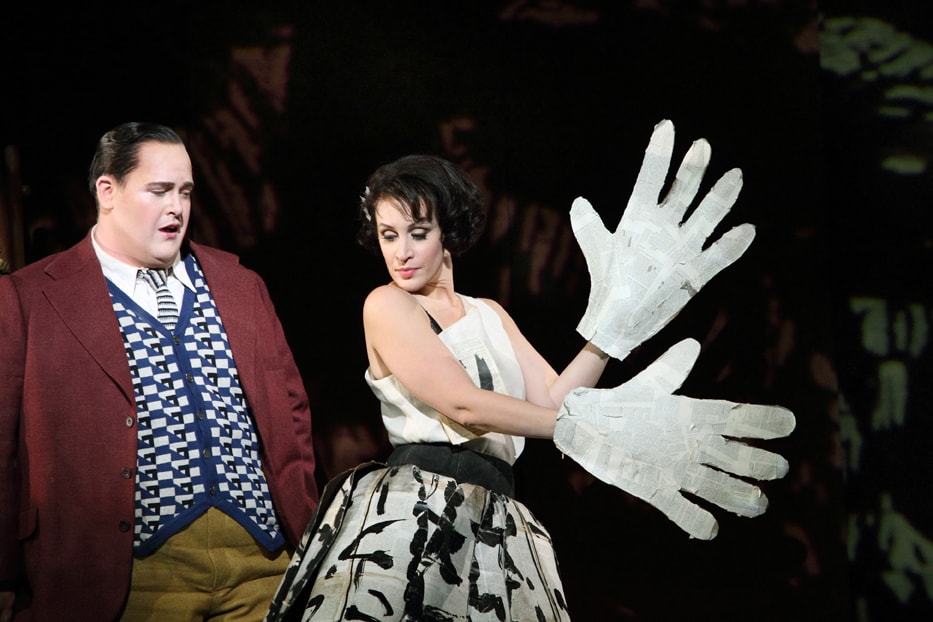 Woman with big white gloves, and man in red jacket from Lulu