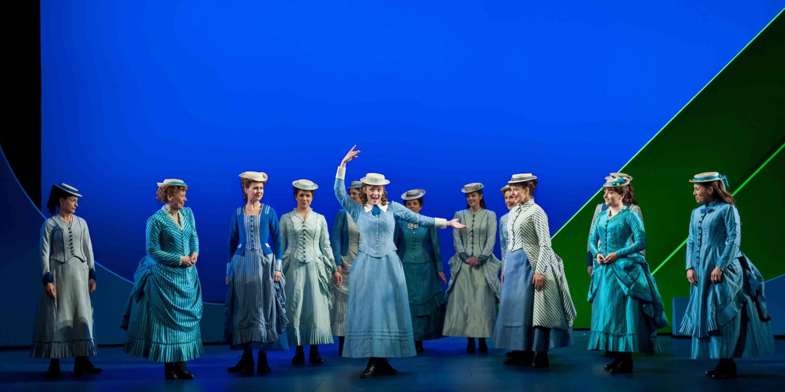 ENO's The Pirates of Penzance Angharad Lyddon and ENO Company in blue dresses
