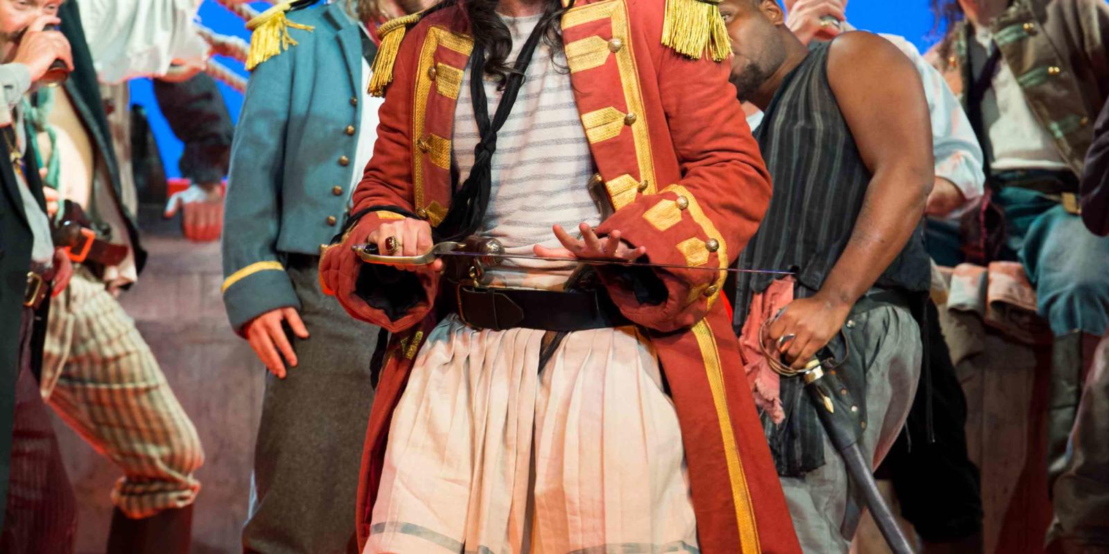 ENO's The Pirates of Penzance - Ashley Riches as The Pirate King. Photo by Tom Bowles