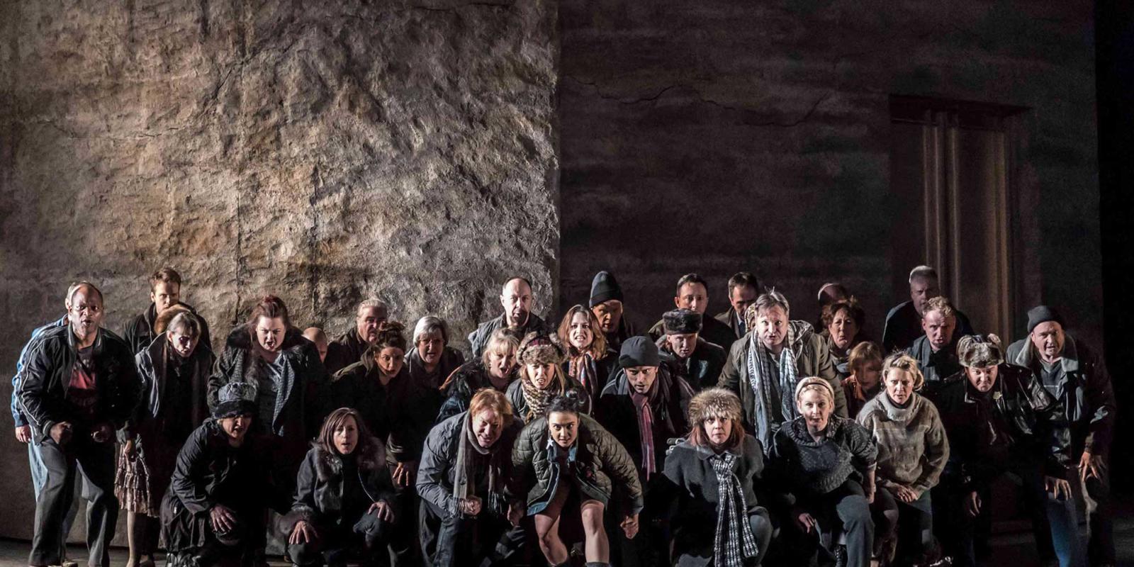 The Winter's Tale Chorus crouching down in winter clothes