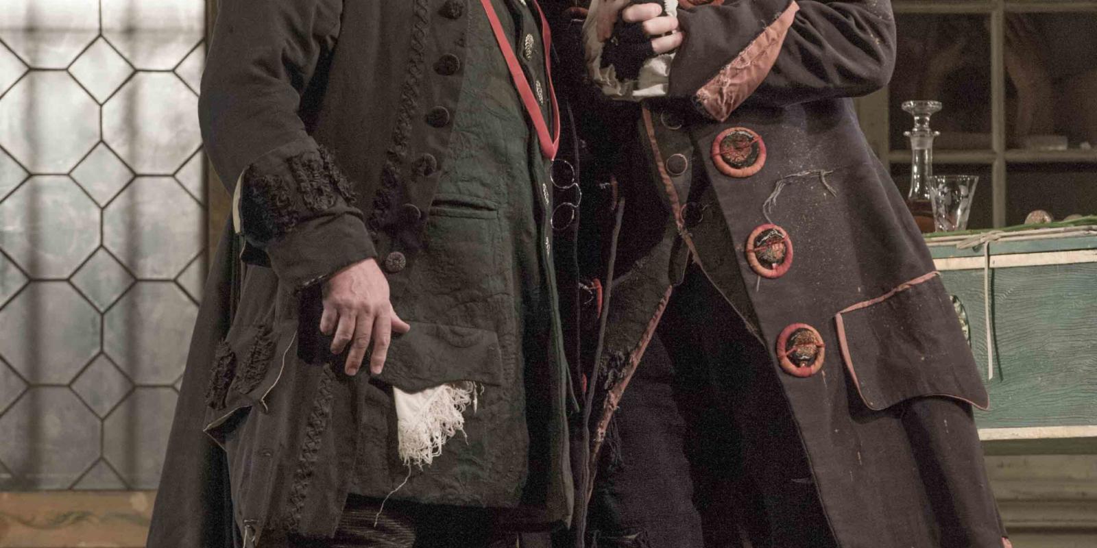 two men singing towards each other