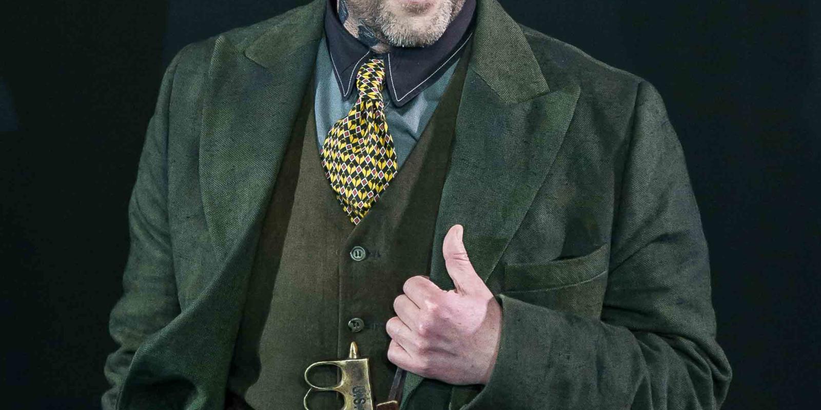 a man in a suit smiling