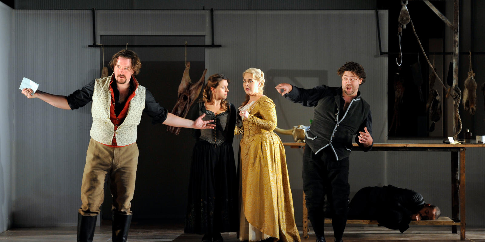 An image of Benedict Nelson, Mary Bevan, Sarah Jane Brandon and David Stout in Fiona Shaw's 2014 production of The Marriage of Figaro