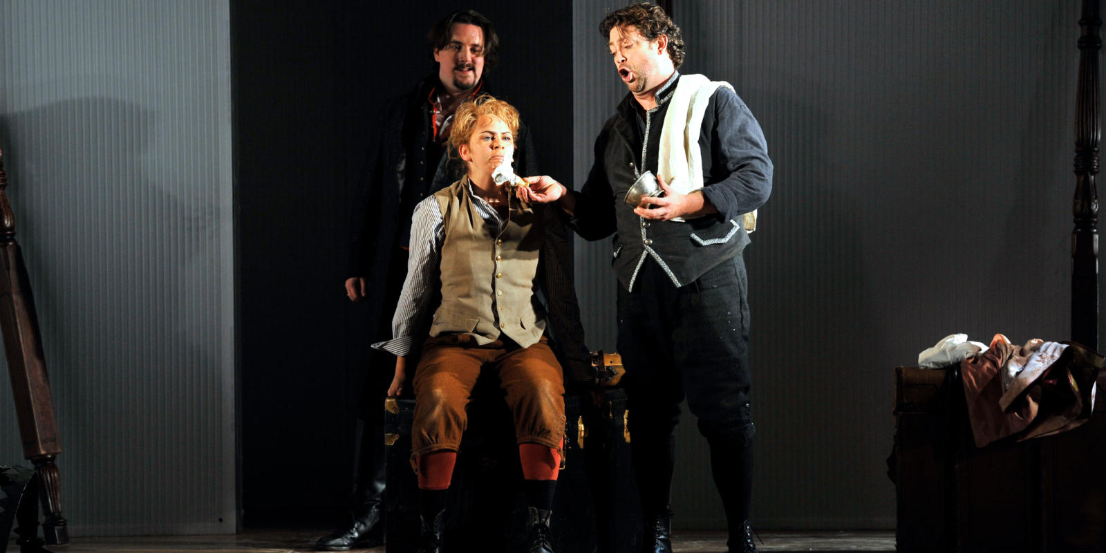 An image of Benedict Nelson, Samantha Price and David Stout in Fiona Shaw's 2014 production of The Marriage of Figaro