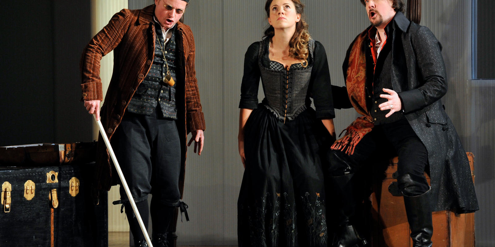 An image of Colin Judson, Mary Bevan and Benedict Nelson in Fiona Shaw's 2014 production of The Marriage of Figaro
