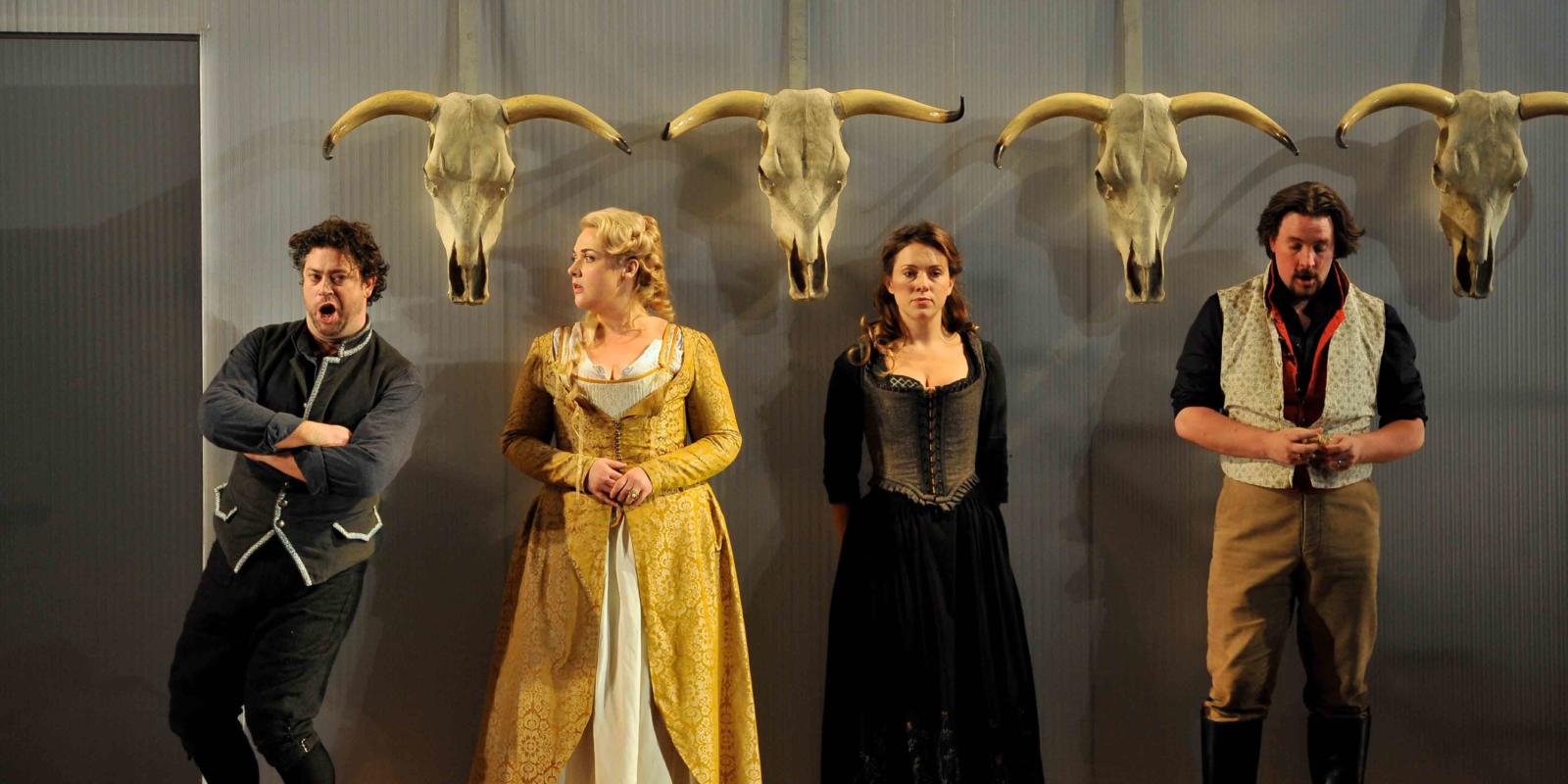 An image of David Stout, Sarah Jane Brandon, Mary Bevan and Benedict Nelson in Fiona Shaw's 2014 production of The Marriage of Figaro
