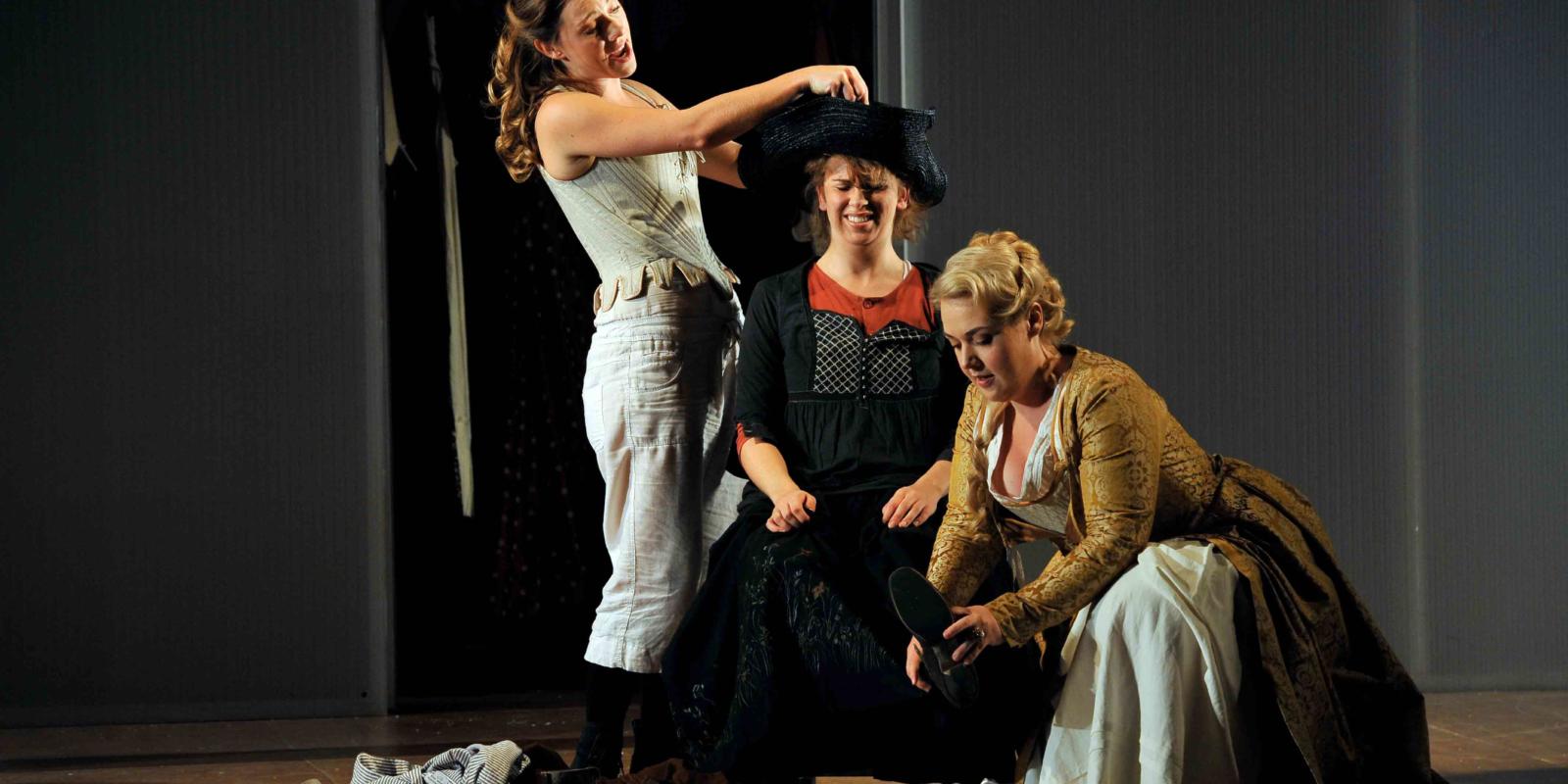 An image of Mary Bevan, Samantha Price, Sarah Jane Brandon in Fiona Shaw's 2014 production of The Marriage of Figaro