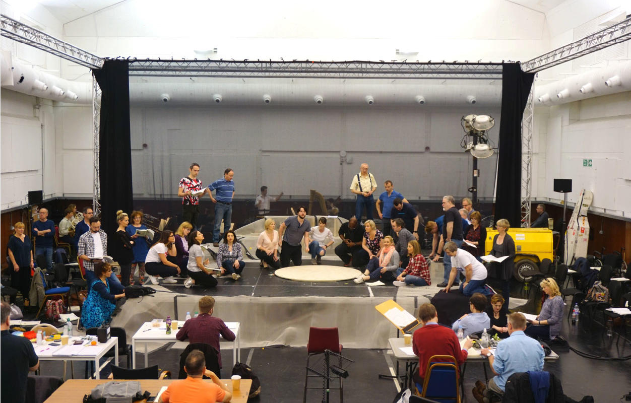 ENO chorus and cast on stage in the rehearsal room