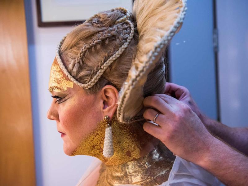 close up of braided woman's hair backstage of Aida