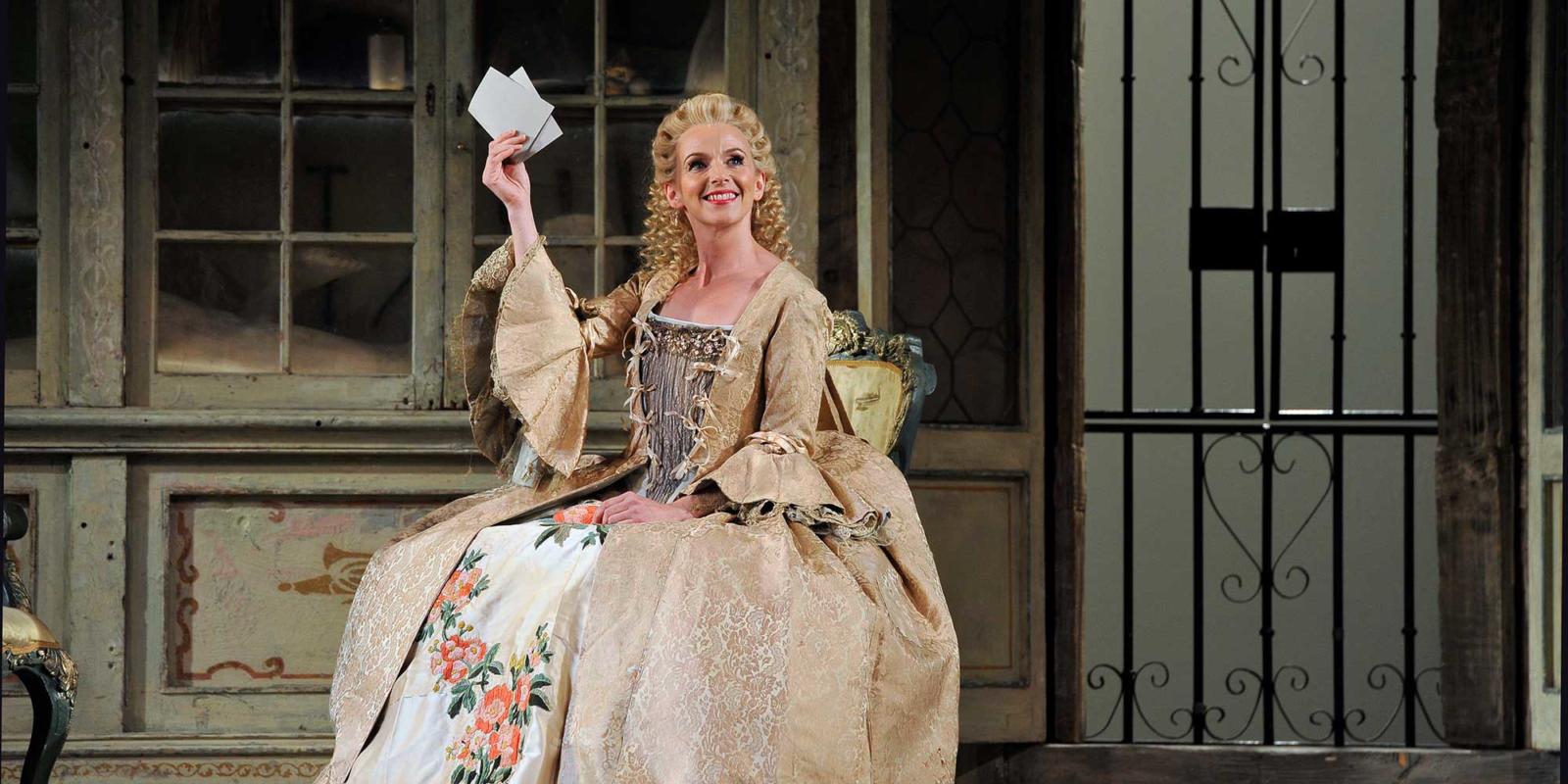 ENO The Barber of Seville: Sarah Tynan in period costume on stage (c) Robbie Jack