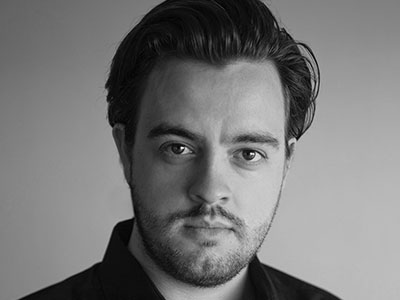 black and white head and shoulder portrait of ben johnson