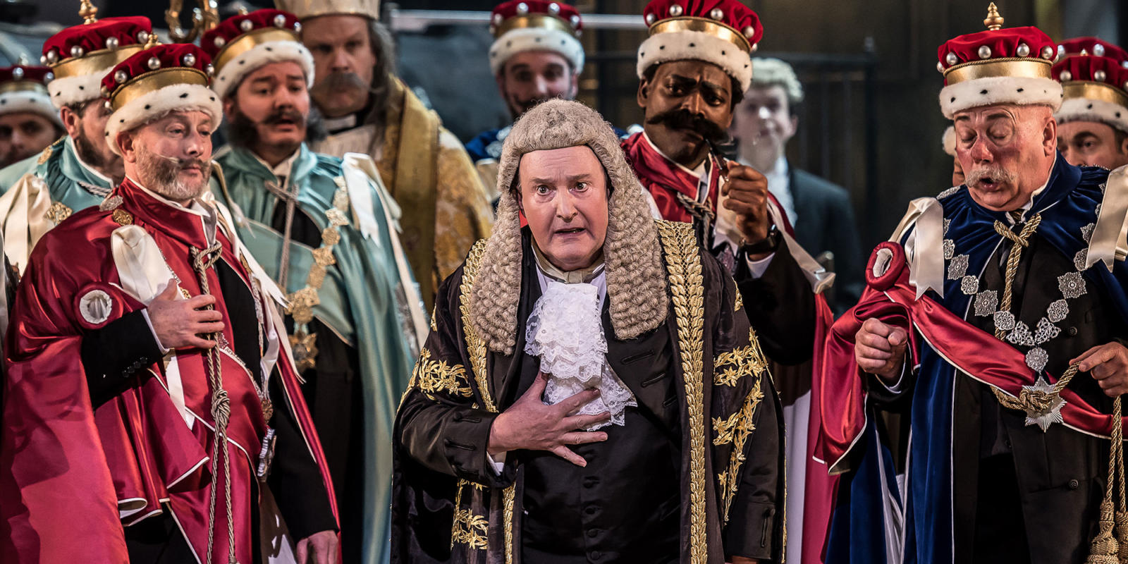 The Lord Chancellor in Iolanthe surrounded by chorus members
