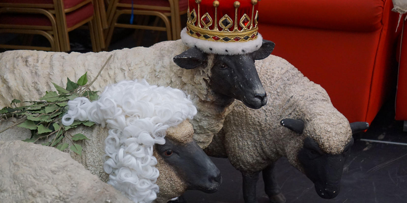 Three sheep props wearing wigs and a crown for ENO's Iolanthe