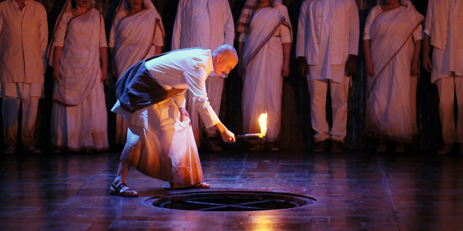 Toby Spence performs on stage in the opera Satyagraha