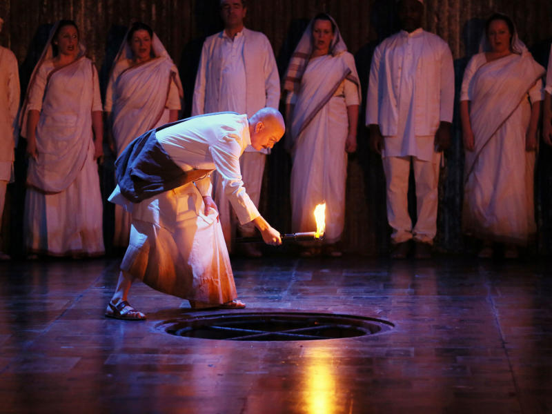 Toby Spence performs on stage in the opera Satyagraha