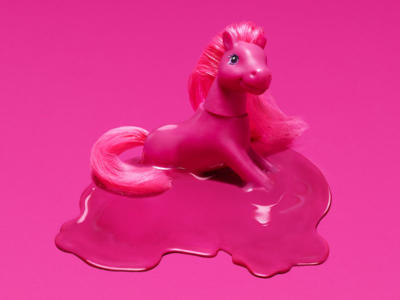 a pink pony melting into a pink background