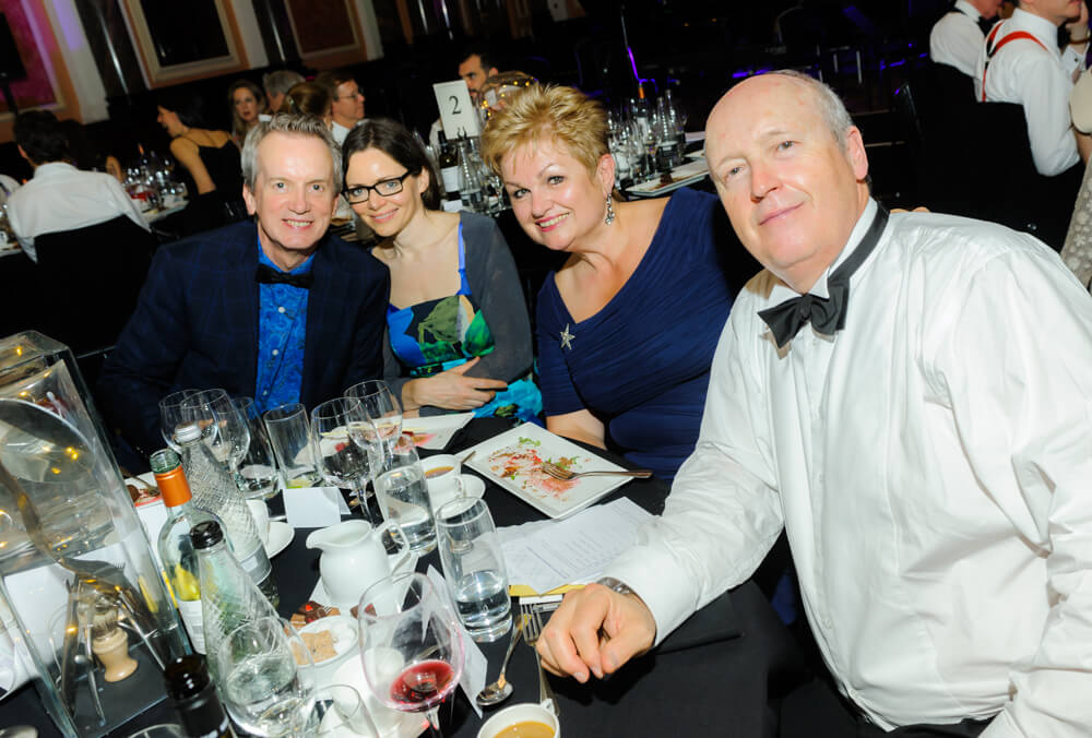 Frank Skinner posing with other guests at ENO's Gala Dinner