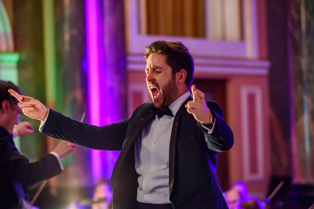 young conductor pointing and screaming at ENO's gala dinner
