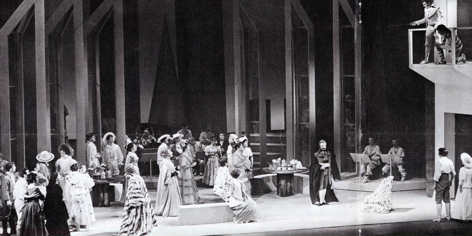 A black and white photograph of ensemble on the stage at the opening night of Don Giovanni in 1968