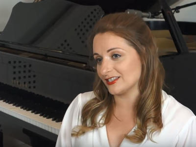 Soraya Mafi sat in front of a piano
