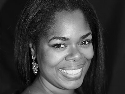 Headshot of Sarah-Jane Lewis smiling to camera