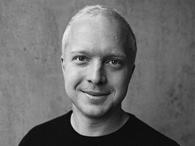 Alex Otterburn looking directly to camera smiling