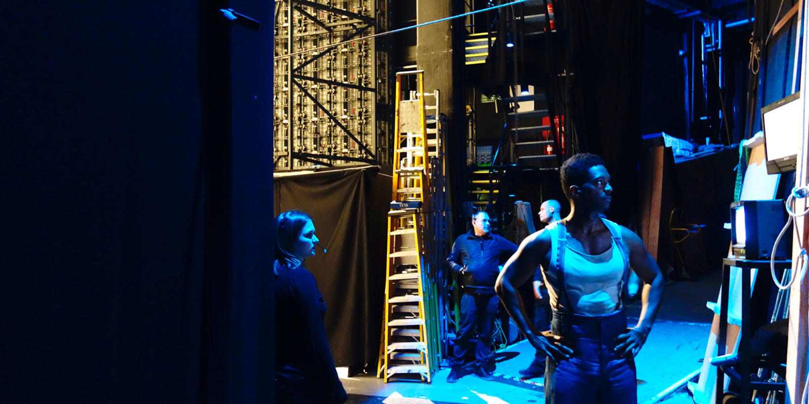 Assistant Stage Manager Becca Vince (left) and Nmon Ford (right) watch the performance from backstage