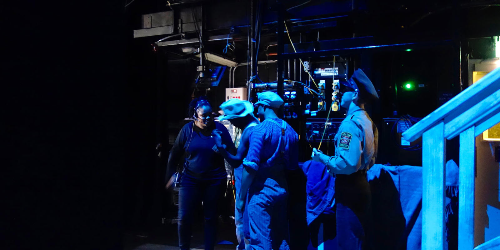Deputy Stage Manager Lorrell Rawlins (left) talks with cast members