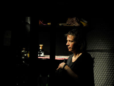 dark image of female artist as part of The Foley Artist
