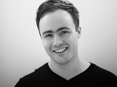 Ben Gernon wearing a black jumper and smiling to camera