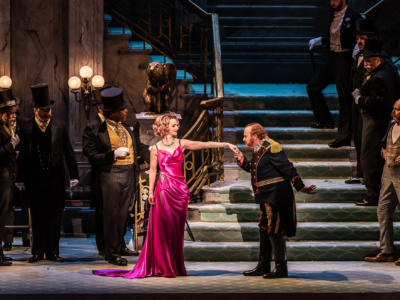 Andre Shore kissing the hand of Sarah Tynan in the Merry Widow