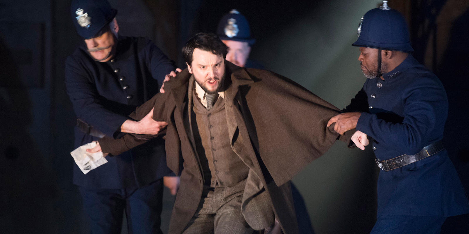 man getting arrested by two police officers