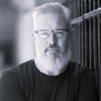 Black and white headshot of simon bailey