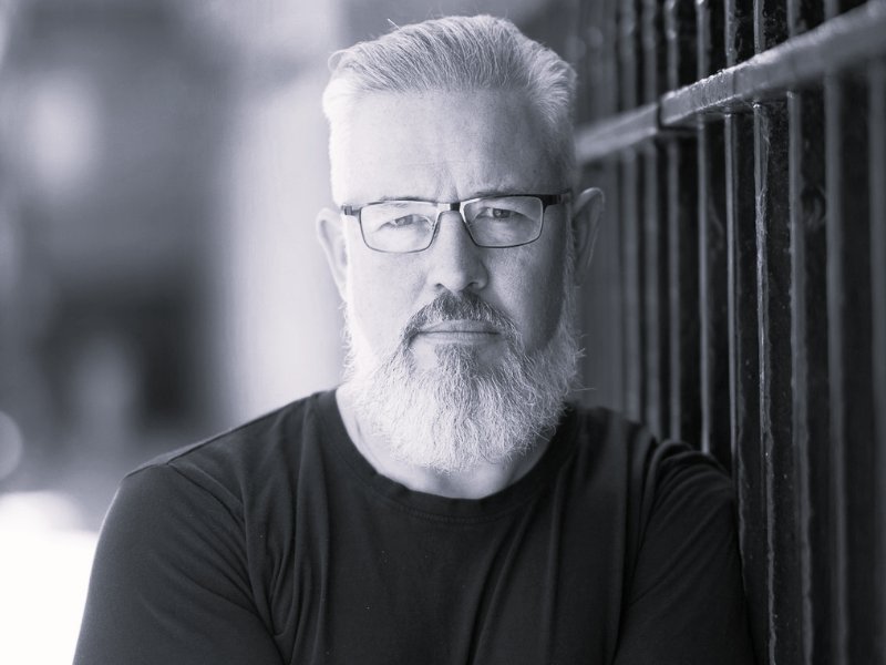 Black and white headshot of simon bailey