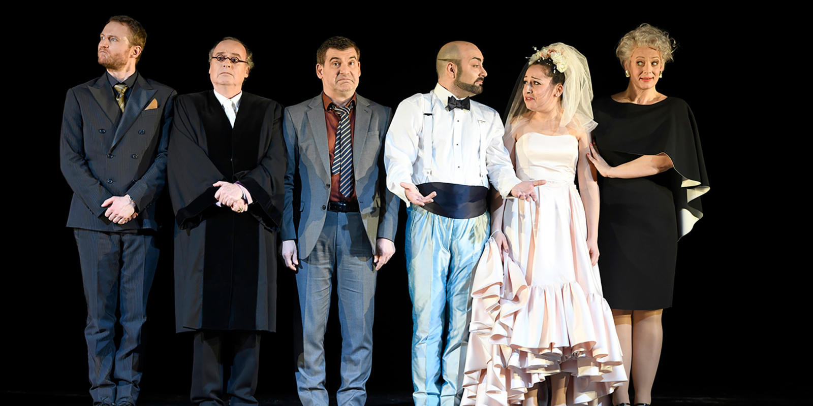 a group of people dressed for a wedding