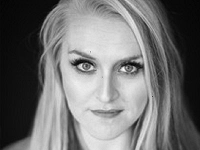 Sioned Gwen Davies looking directly to camera in black and white