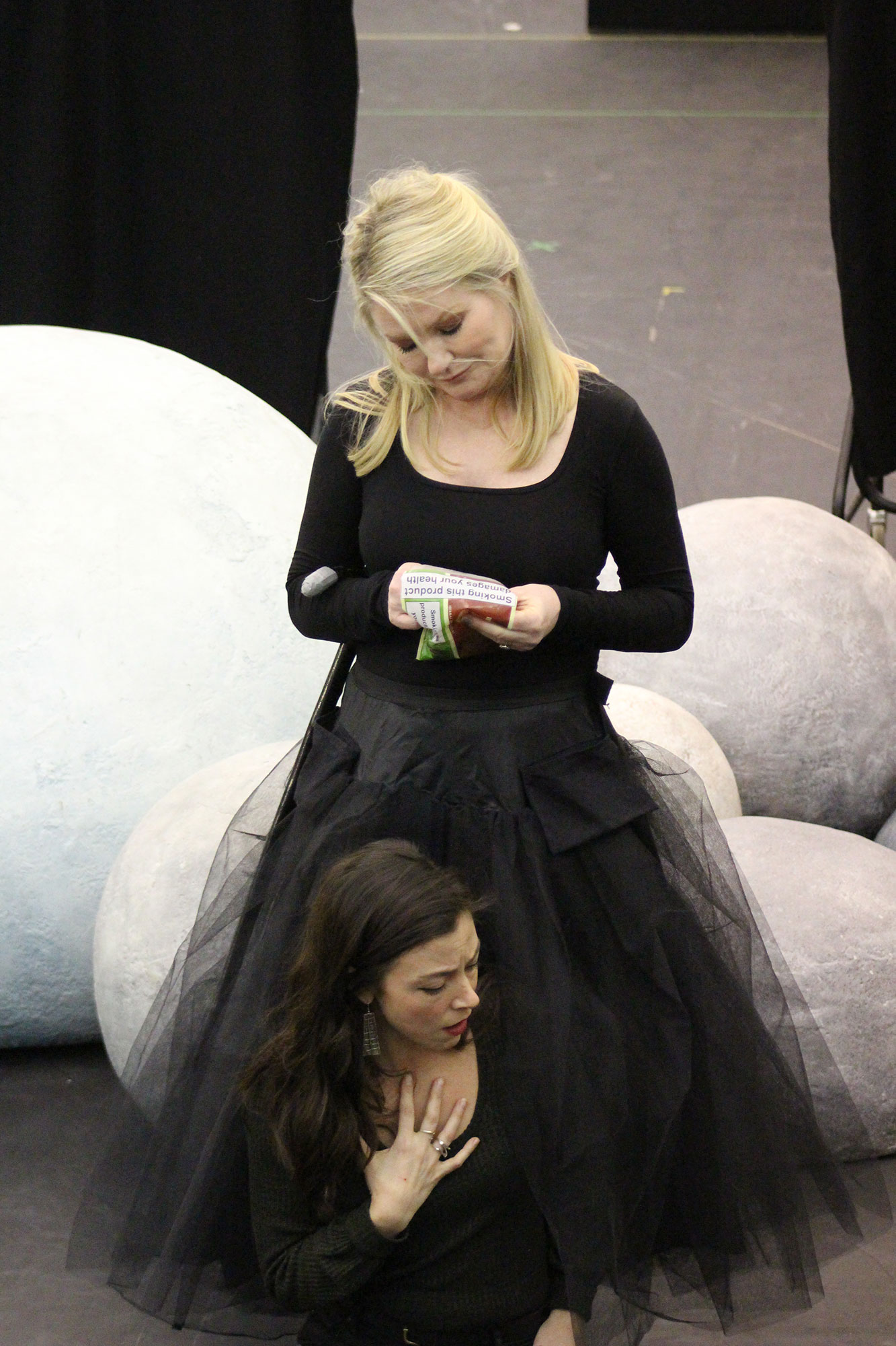two woman in black tulle dress